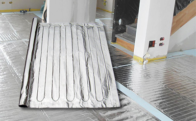 FoilHeat floor heating system being installed.