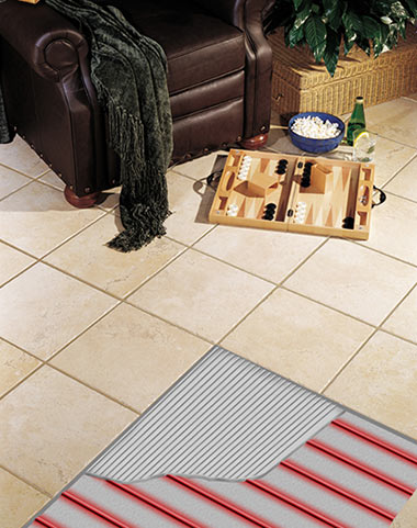 Radiant heated tile floor with cutaway showing the heating cable (and thinset) below. Radiant heated tile floor with cutaway showing the heating cable (and thinset) below.